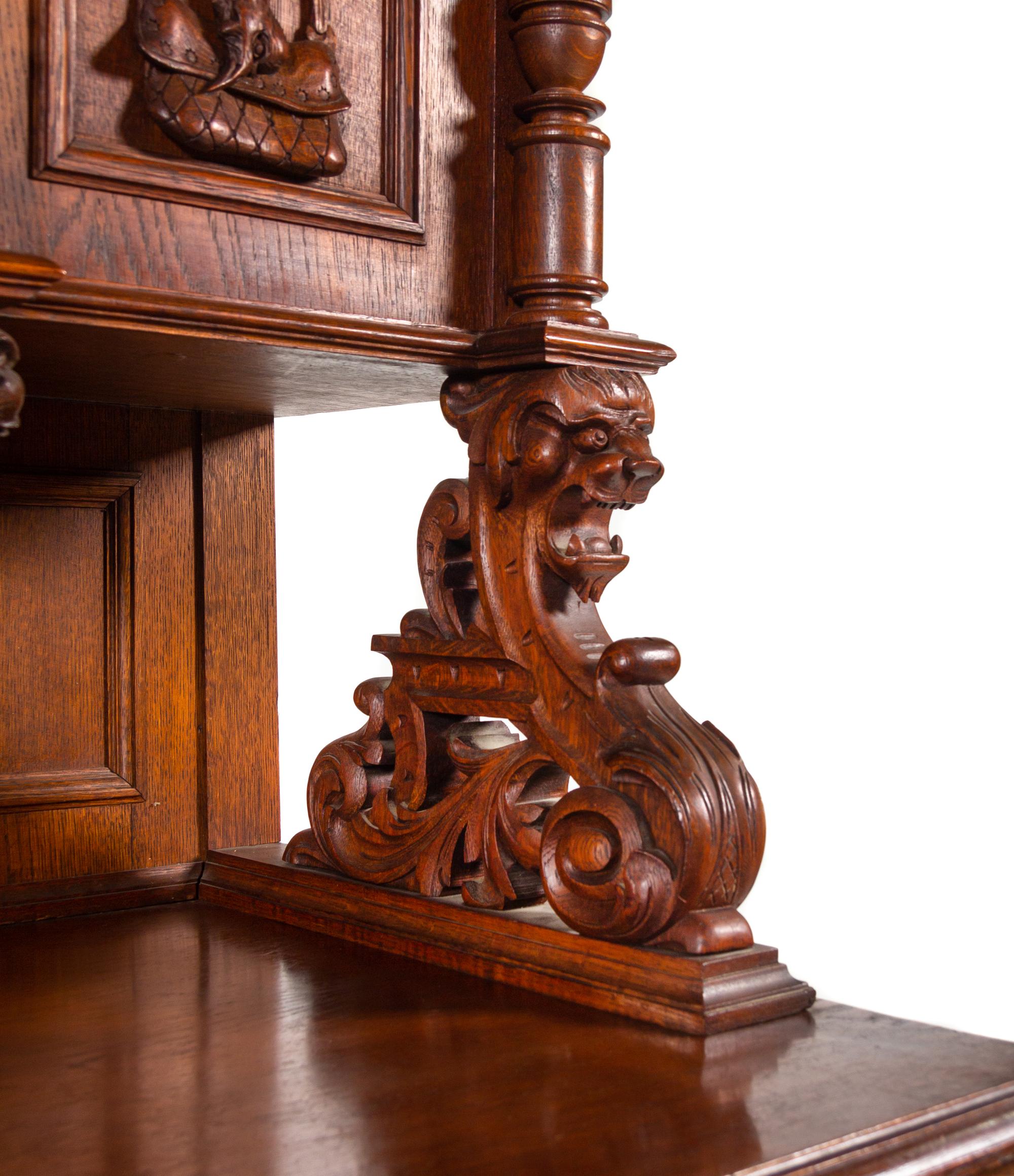 A Black Forest Style Carved Oak Serving Cabinet