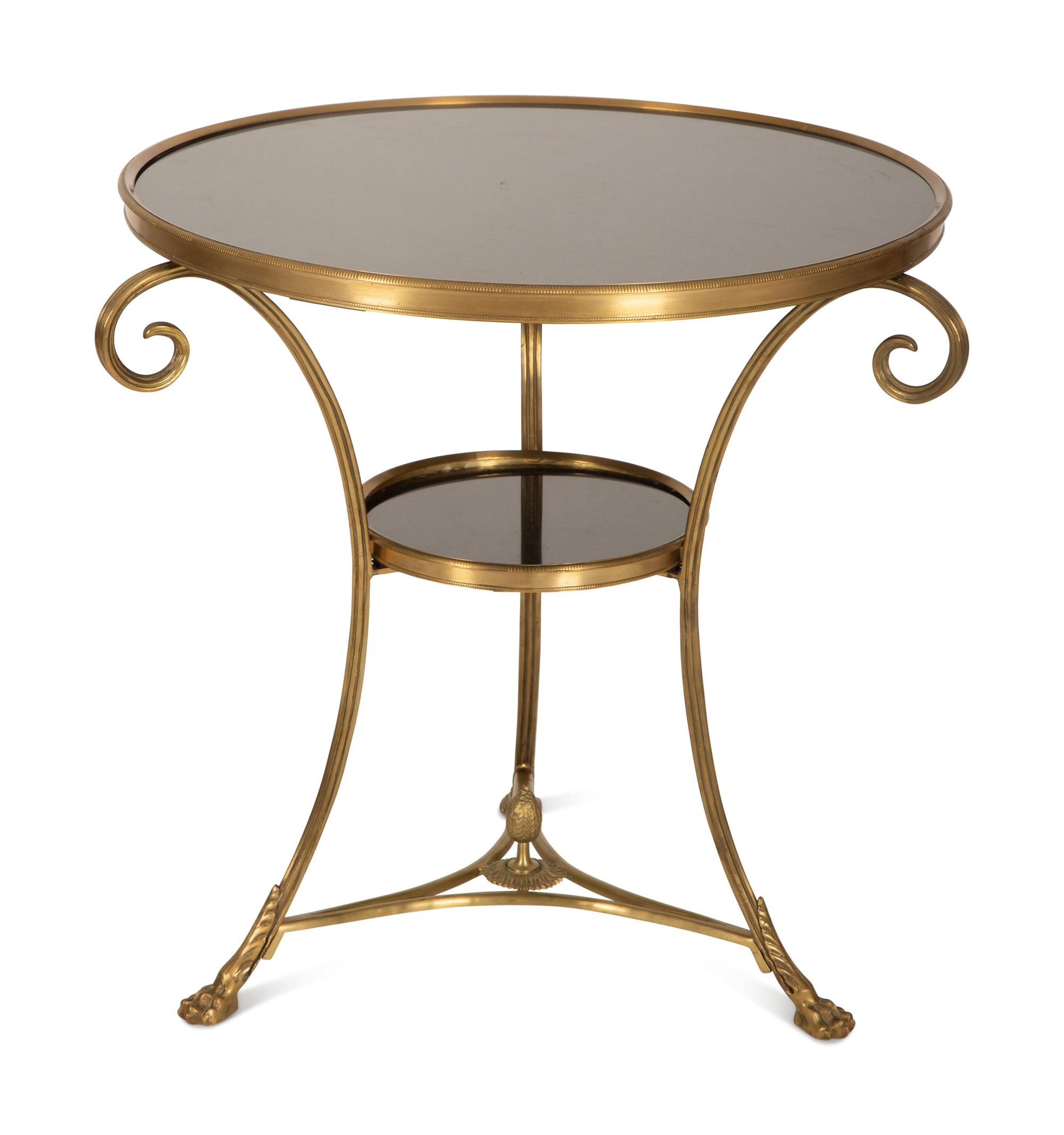 An Empire Style Gilt Metal and Black Granite Guéridon