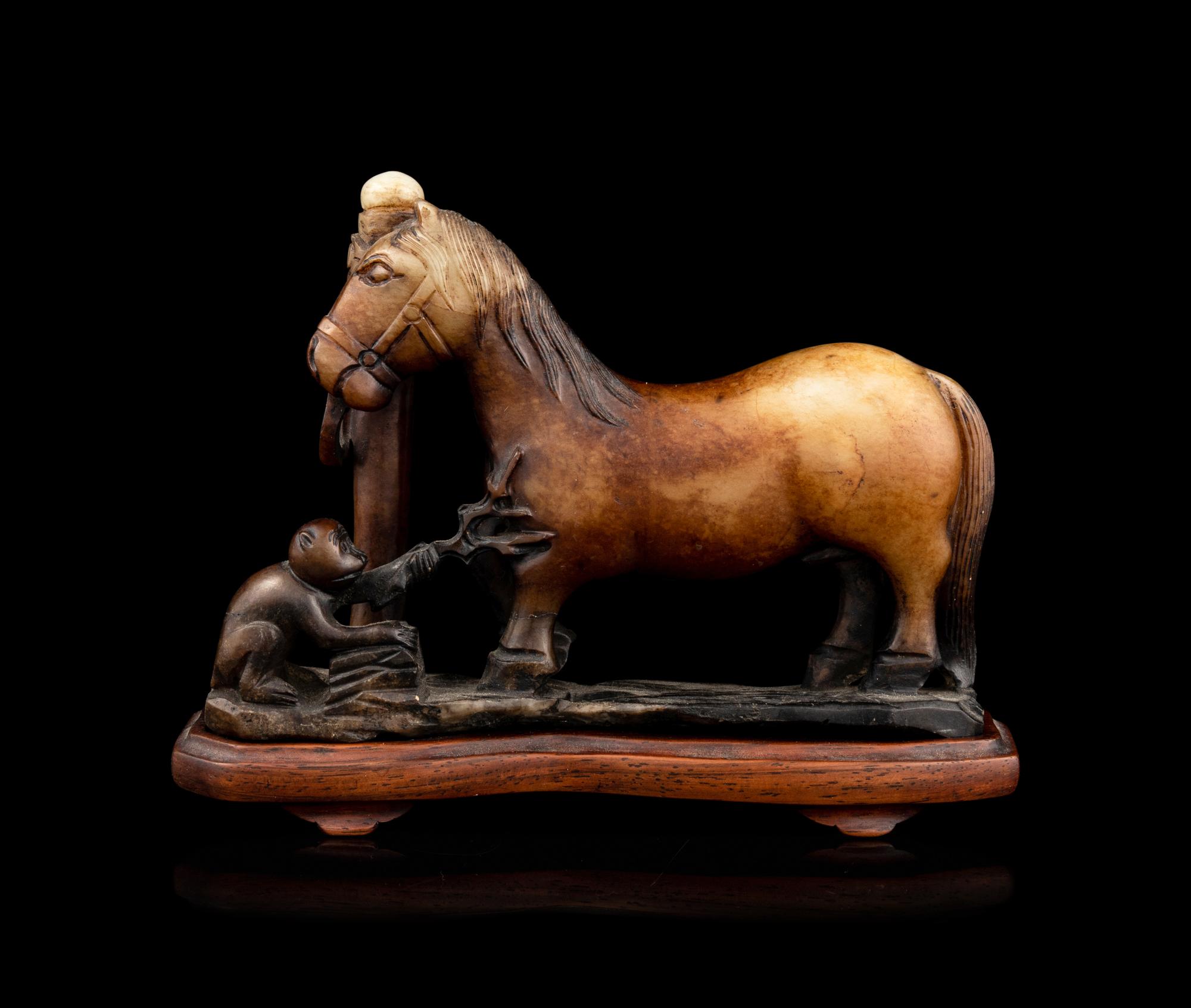 A Carved Russet Jade Figural Group of a Monkey and a Horse