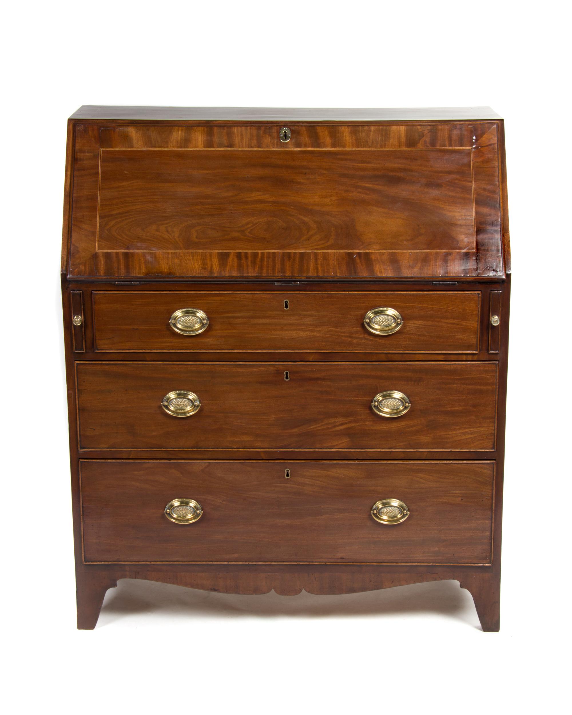 An English Mahogany Slant Front Secretary, EARLY 19TH CENTURY, Height 45 3/4 x width 38 3/4 x depth 19 inches. — EARLY 19TH CENTURY,