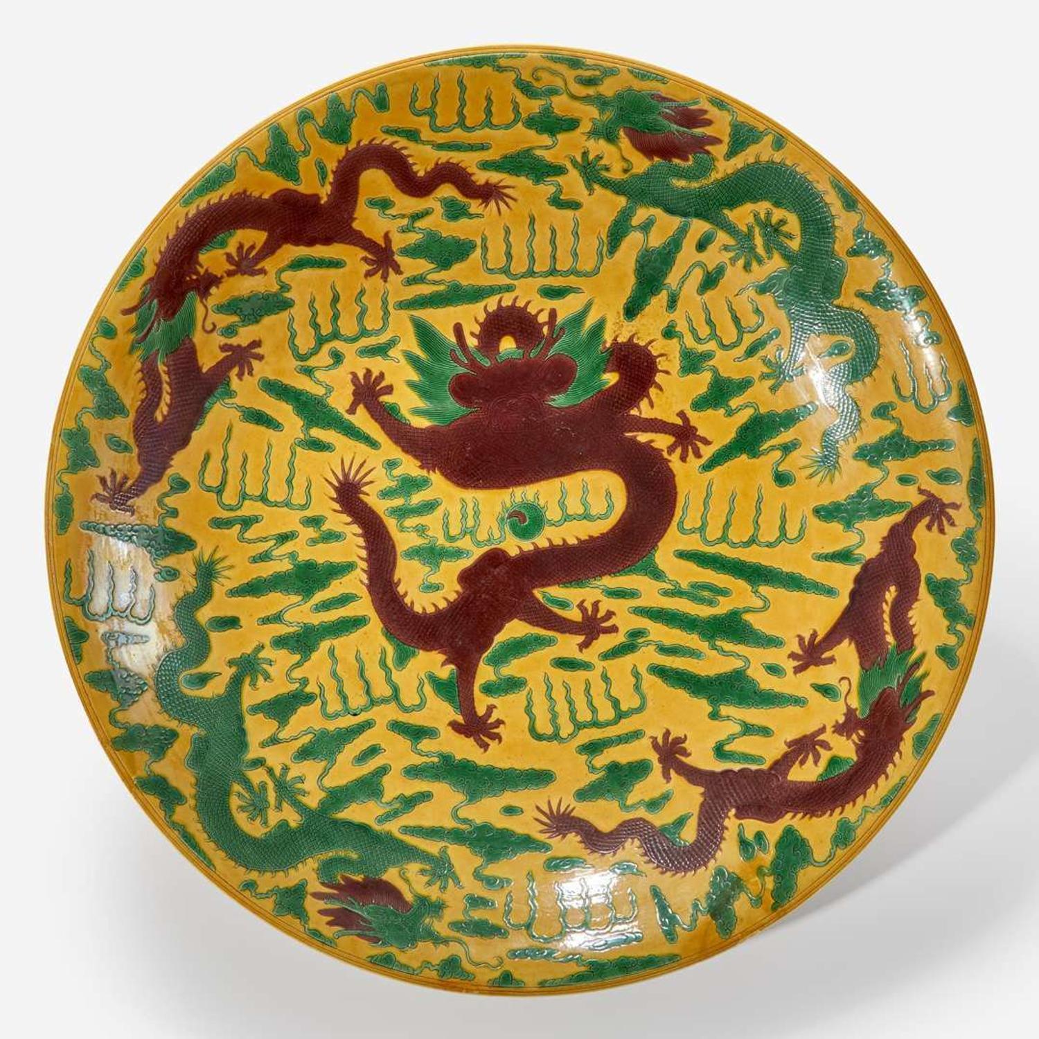 A large Chinese yellow-ground “Dragons” charger