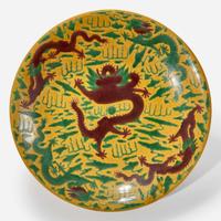 A large Chinese yellow-ground “Dragons” charger