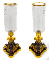 A Pair of Continental Gilt and Patinated Metal Hurricane Candlesticks Height 18 5/8 inches. — 19TH CENTURY