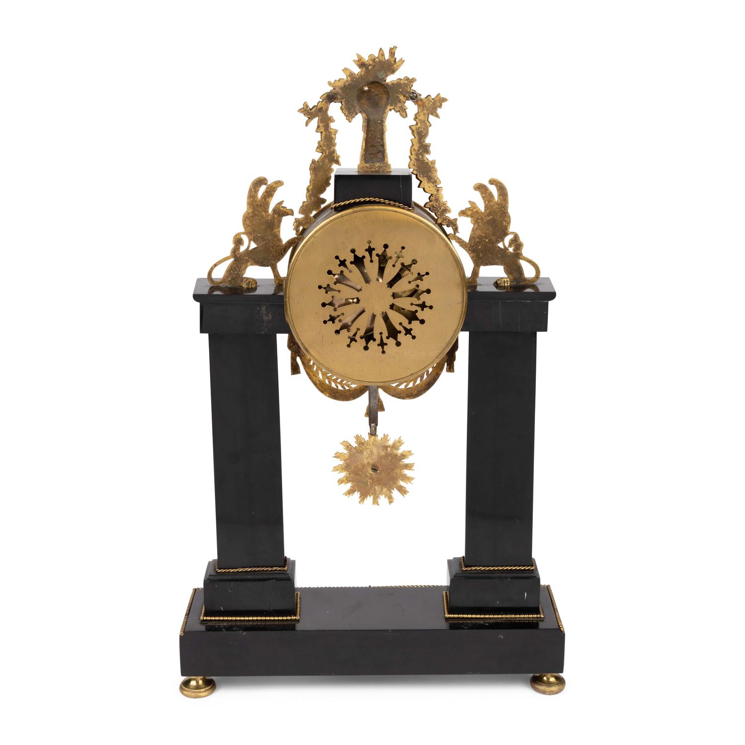 An Empire Patinated and Gilt Bronze Mantel Clock