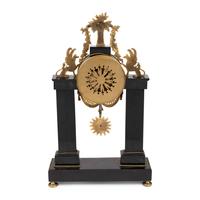 An Empire Patinated and Gilt Bronze Mantel Clock
