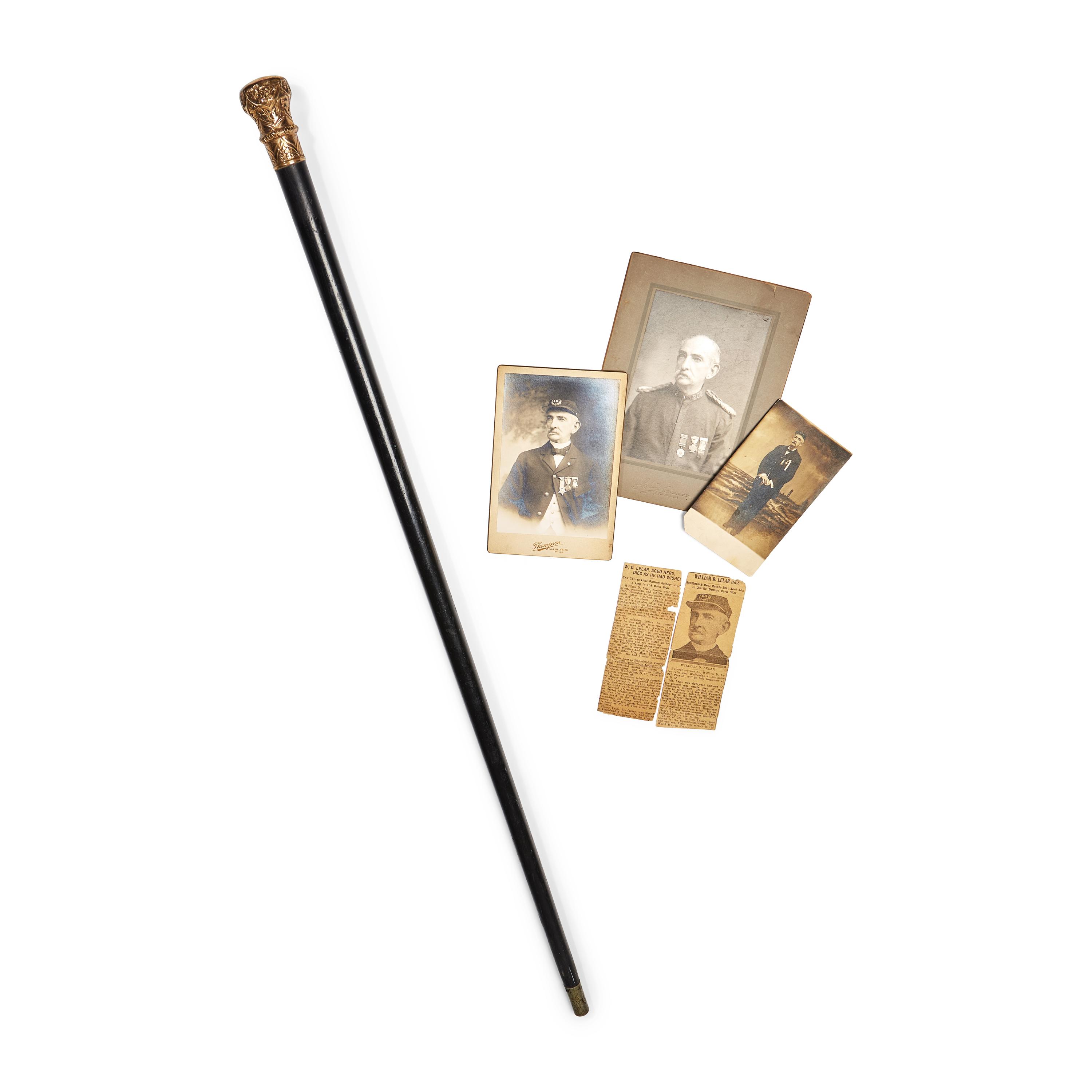 A Gold-Mounted and Ebonized Wood Walking Stick
