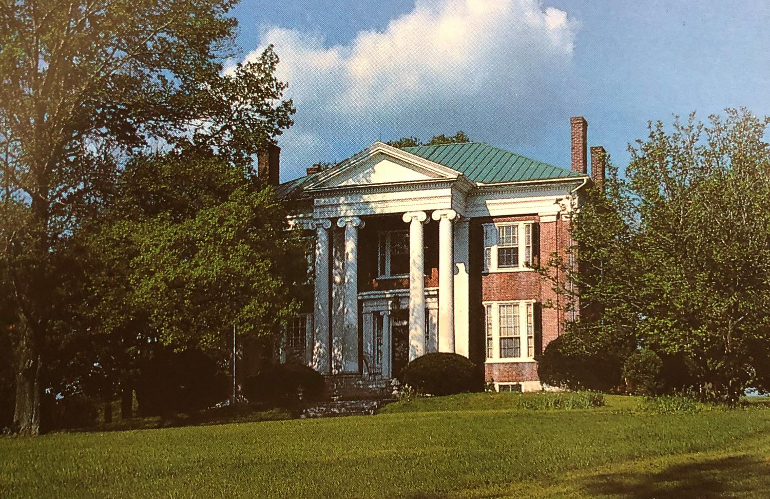 A Pair of Irish George II Style Carved Mahogany Double-Back Settees