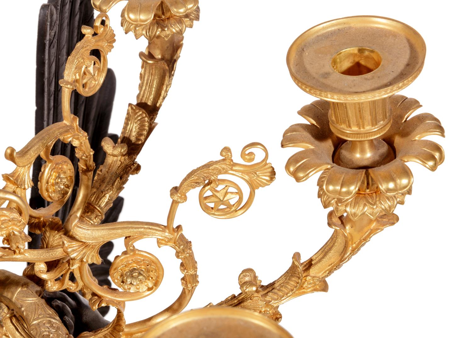 A Pair of Empire Style Gilt and Patinated Cast Metal Seven-Light Torchères