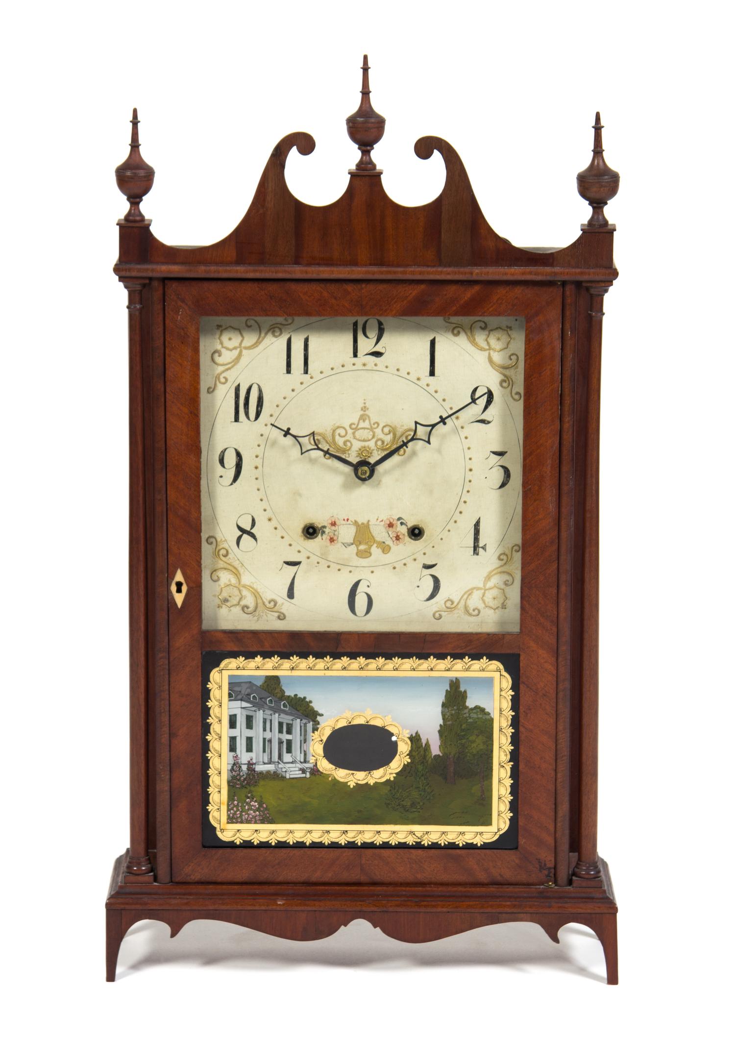 An American Mahogany Pillar and Scroll Clock Height 31 1/2 inches.