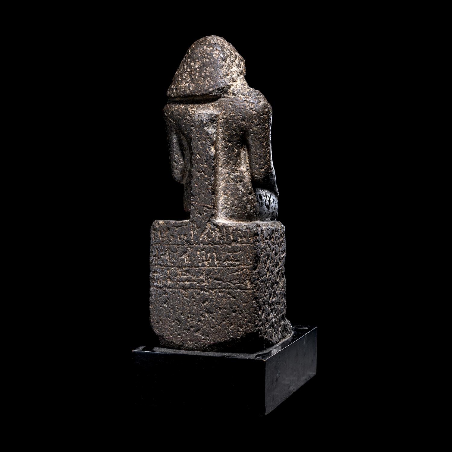 An Egyptian Diorite Seated Figure