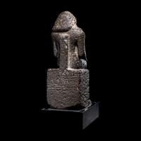 An Egyptian Diorite Seated Figure