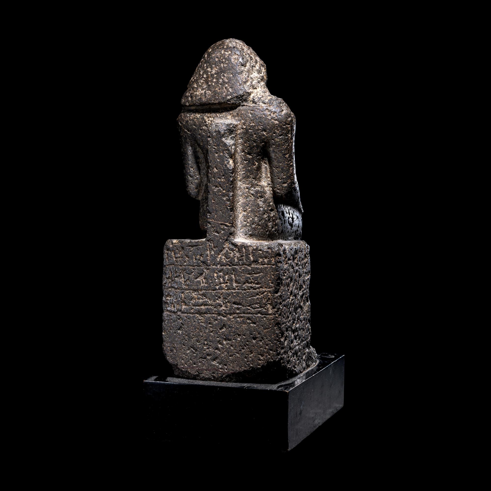 An Egyptian Diorite Seated Figure