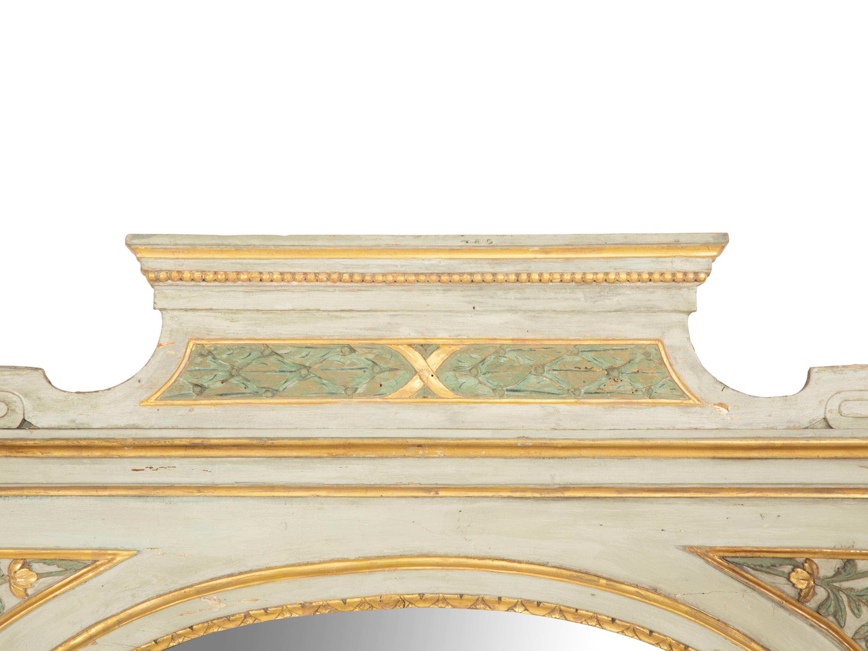 A North Italian Painted and Parcel Gilt Mirror