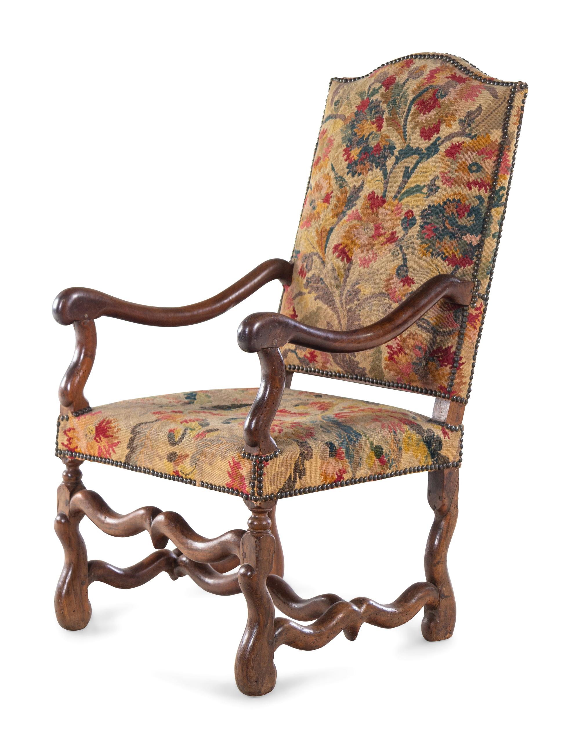 A Louis XIV Walnut Fauteuil à la Reine with Needlework Upholstery