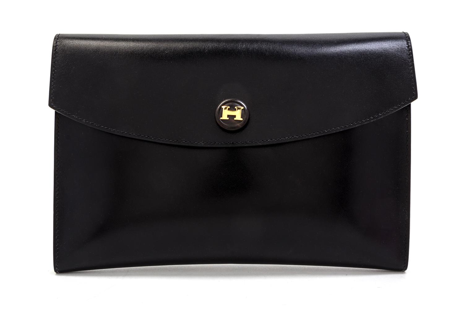 An Hermes Black Leather Rio Clutch, 9 1/2 x 6 1/2 x 1 inches.