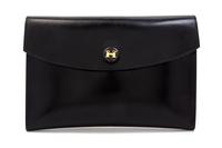 An Hermes Black Leather Rio Clutch, 9 1/2 x 6 1/2 x 1 inches.
