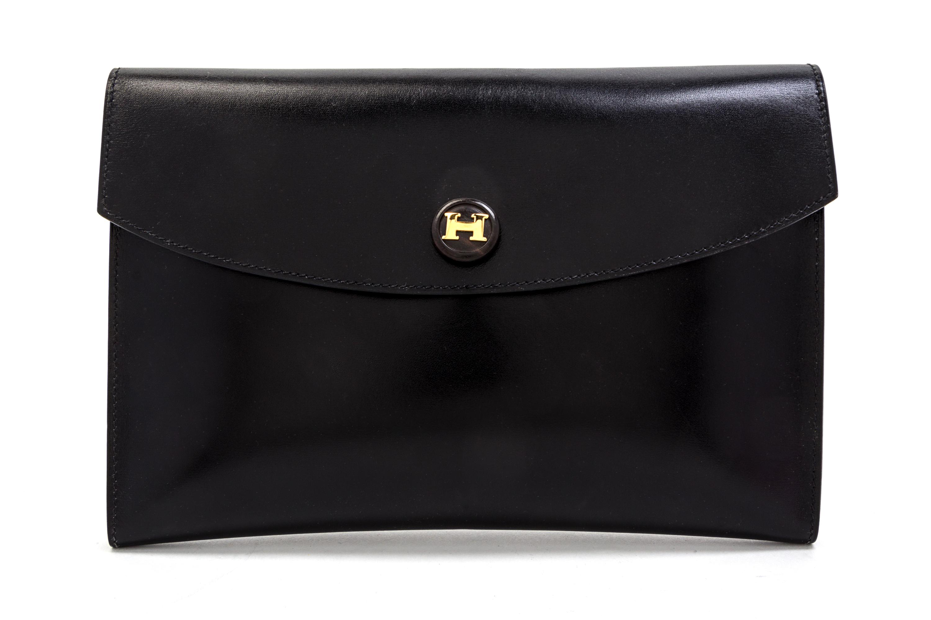 An Hermes Black Leather Rio Clutch, 9 1/2 x 6 1/2 x 1 inches.