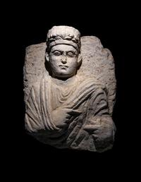 A Palmyrene Limestone Bust of a Priest