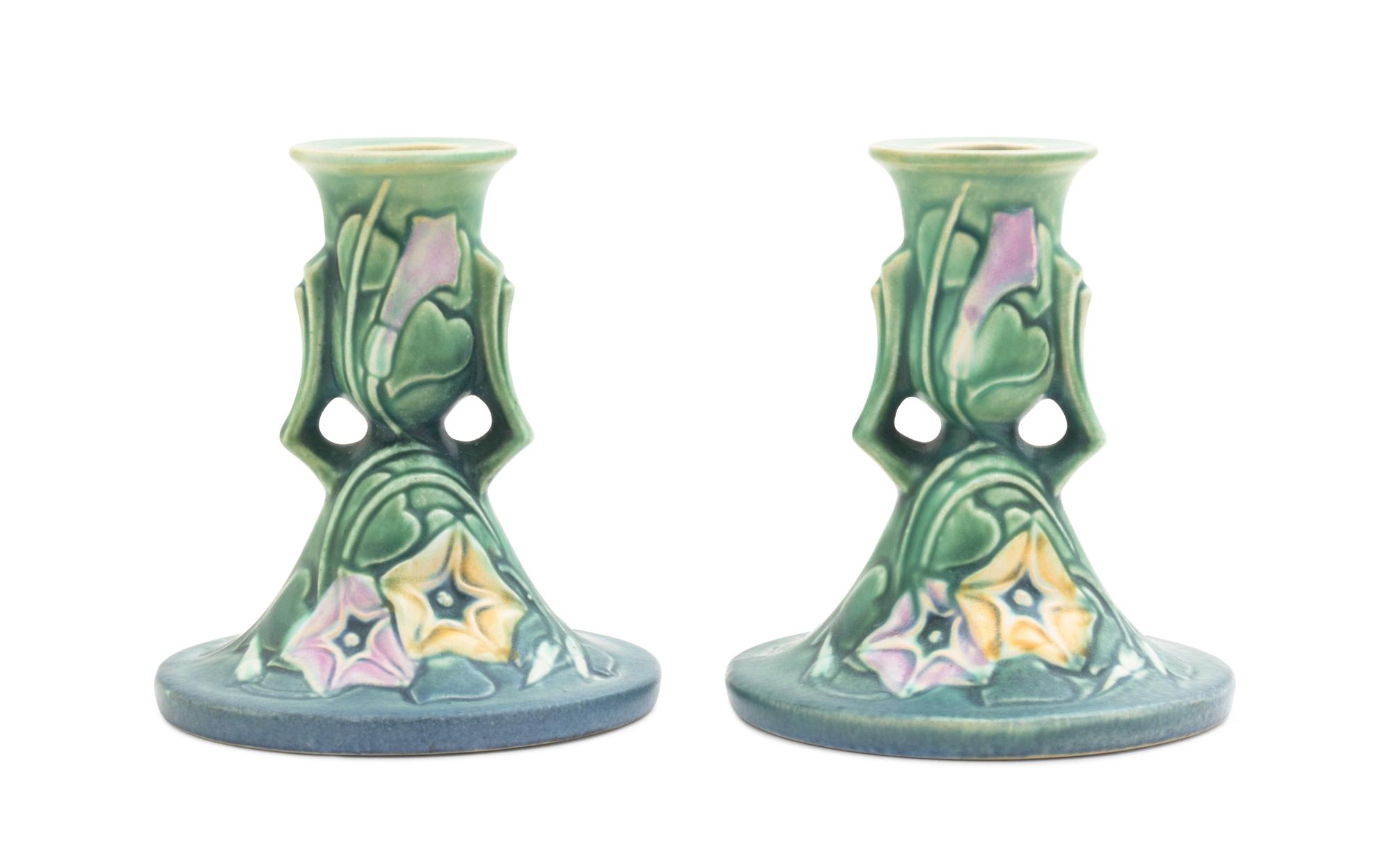 A Pair of Roseville Morning Glory Candlesticks Height 4 3/4 inches.