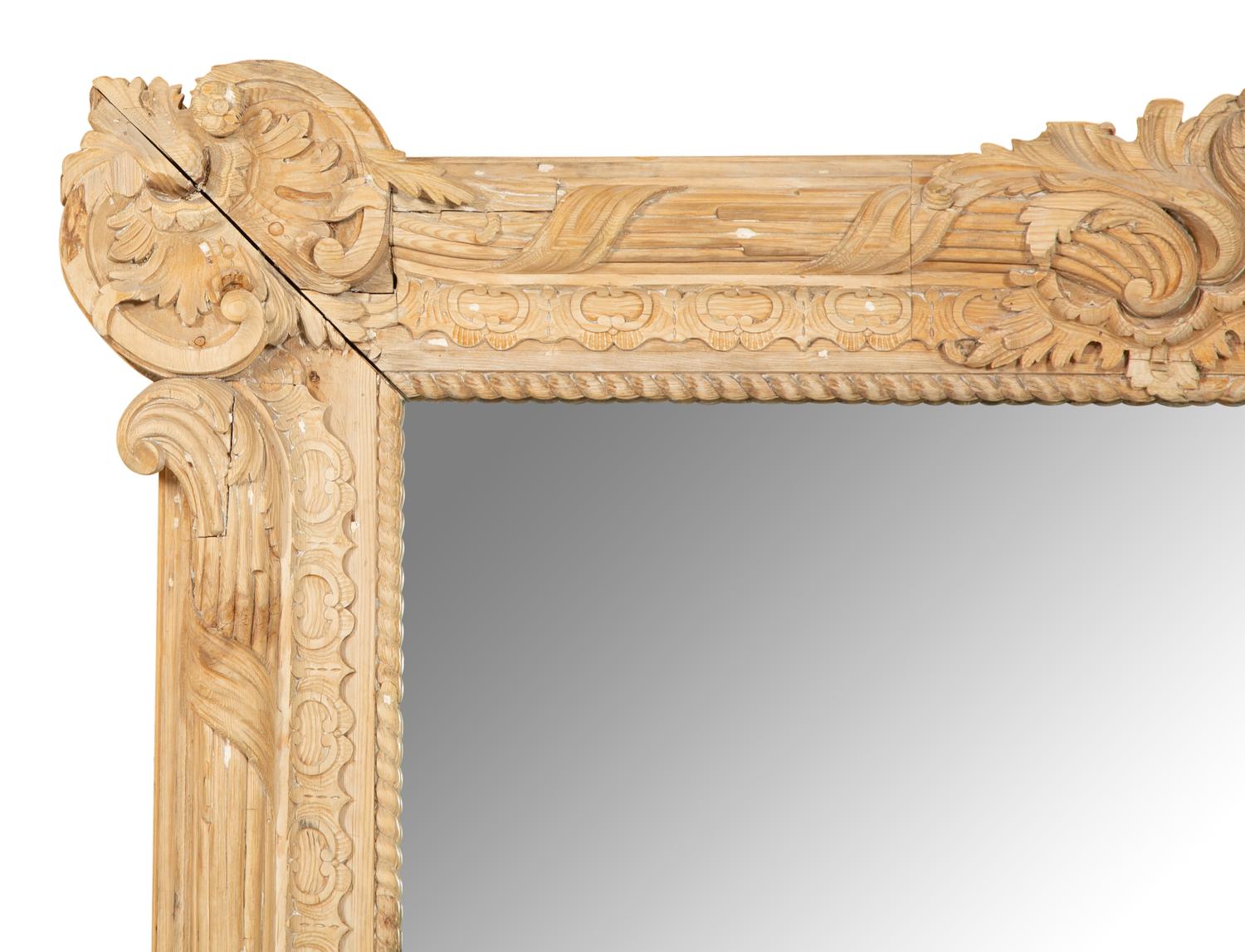 A Large Louis XVI Style Carved Stripped Pine Mirror