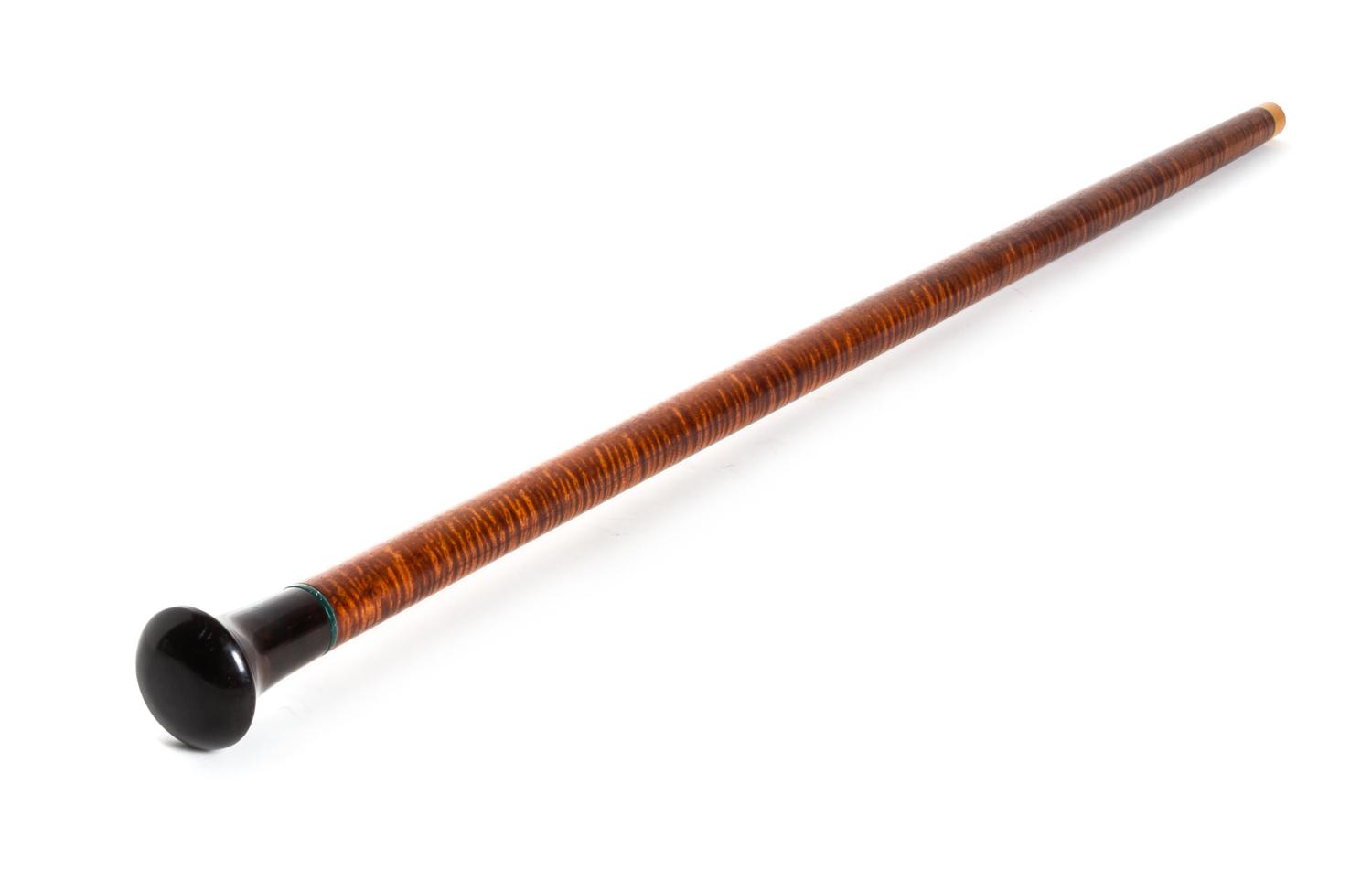 A Contemporary Carved Wood Walking Stick, Length of handle 3 x length overall 35 1/4 inches.