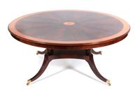 A Regency Style Flame Mahogany Dining Table Height 31 x diameter 70 inches. — 20TH CENTURY