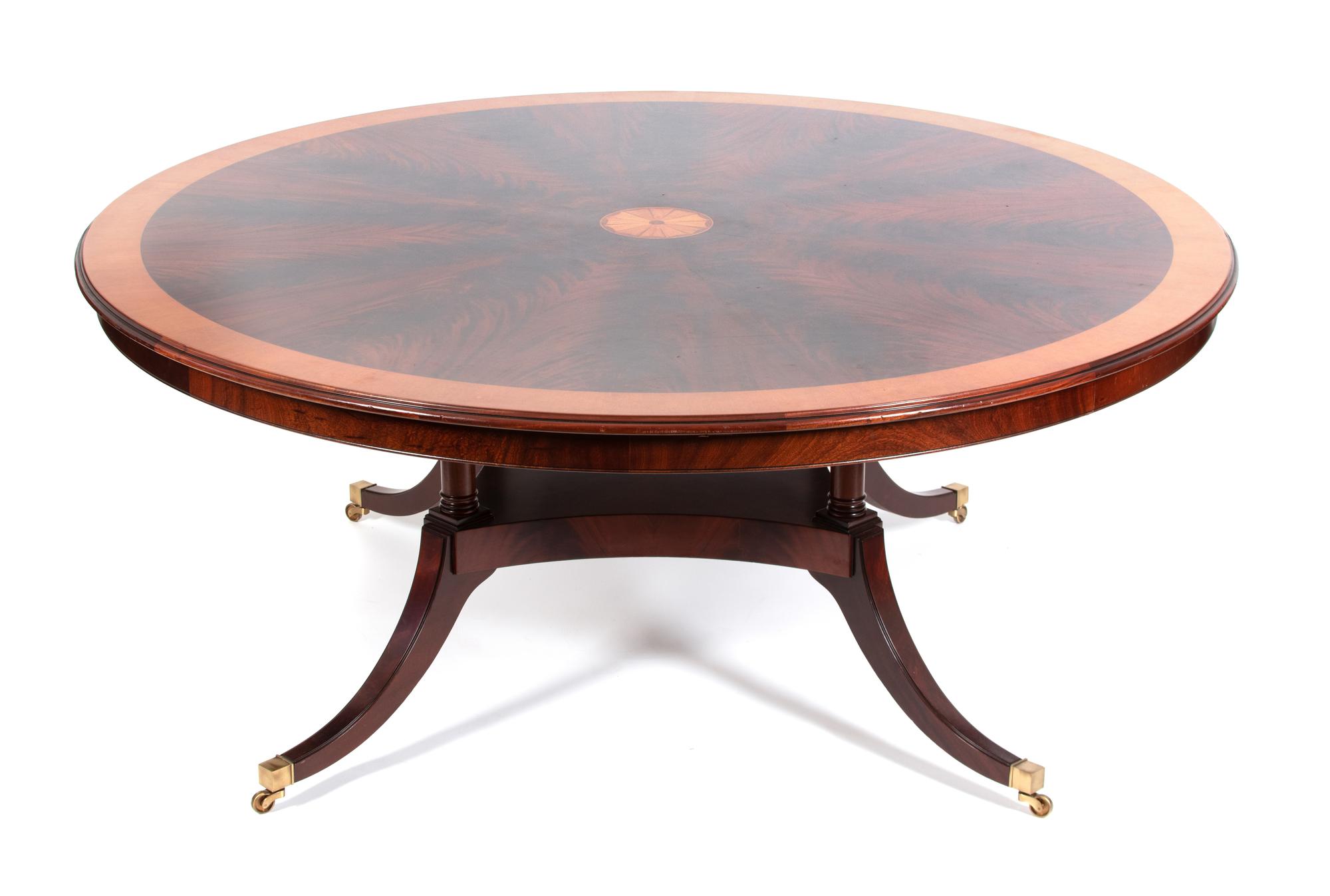A Regency Style Flame Mahogany Dining Table Height 31 x diameter 70 inches. — 20TH CENTURY