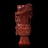 A Chinese Carved Amber Archaistic Gong Vase and Cover, Late Qing Dynasty 清晚期 琥珀仿古觥