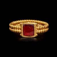 A Roman Gold and Garnet Finger Ring with Cabochon