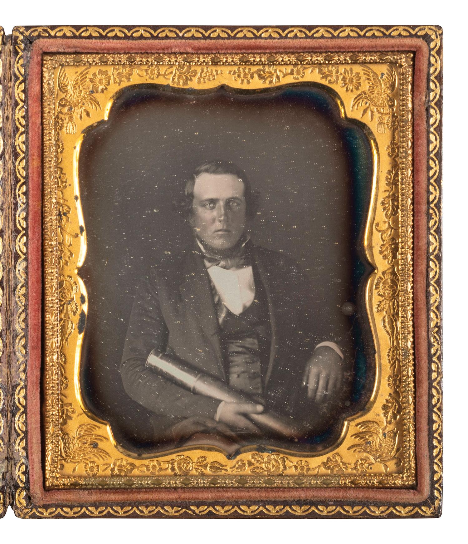 [EARLY PHOTOGRAPHY]. Sixth plate daguerreotype portrait of a man with a telescope, with letter from Eben Seavey of Scarborough, Maine referencing a Captain Elisha Newcomb.