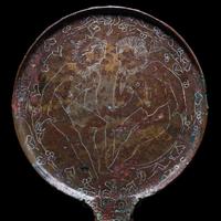An Etruscan Bronze Mirror with Incised Scene of Hercules and Apollo