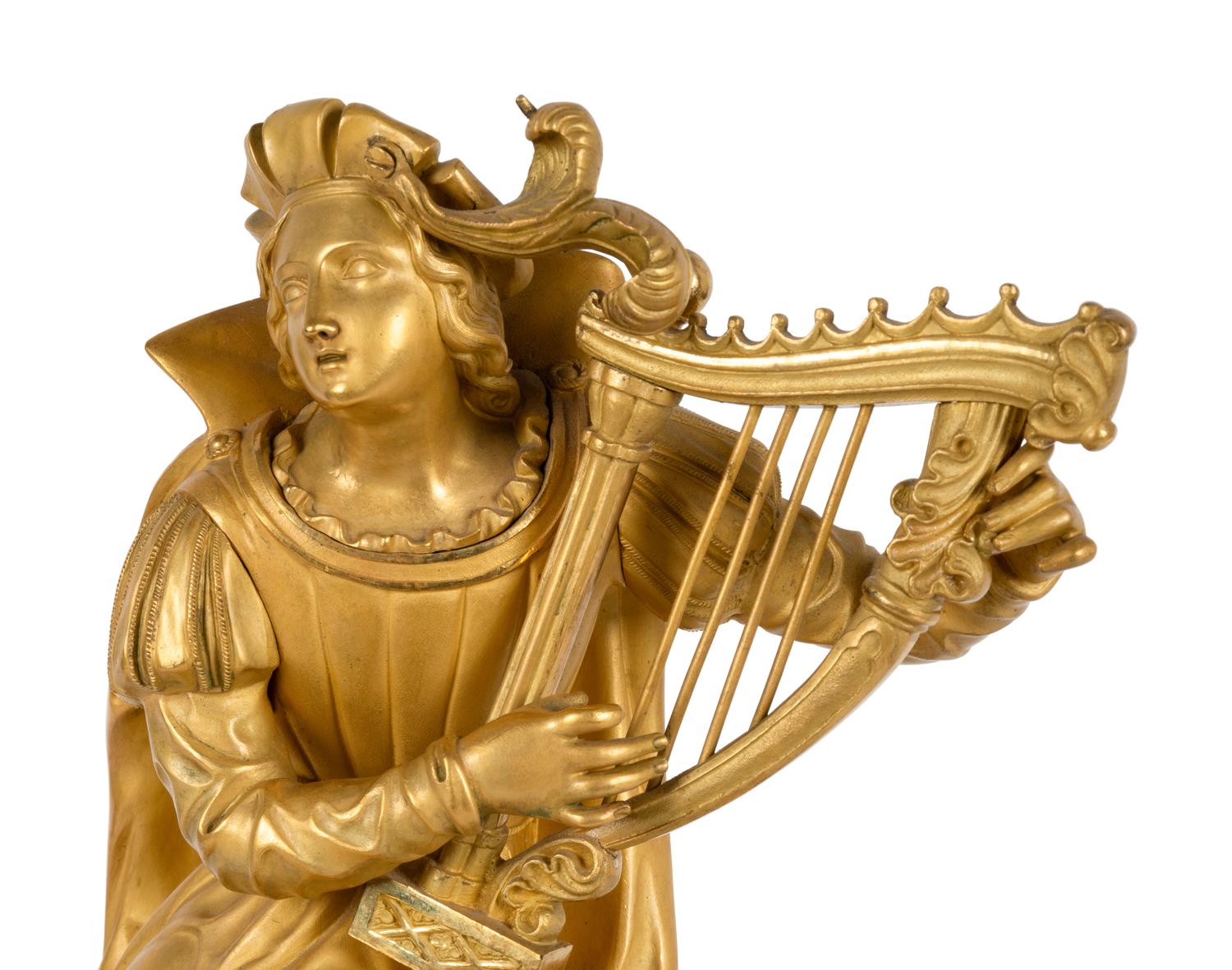 A Charles X Patinated and Gilt Bronze Figural Mantel Clock