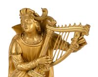 A Charles X Patinated and Gilt Bronze Figural Mantel Clock