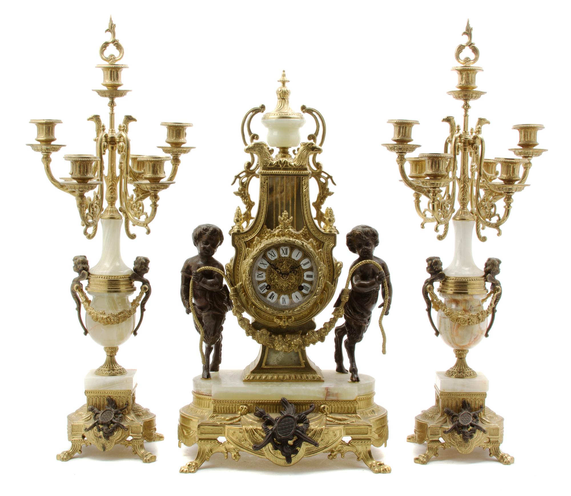 A Neoclassical Style Gilt Metal and Onyx Clock Garniture, Height of first 24 inches.