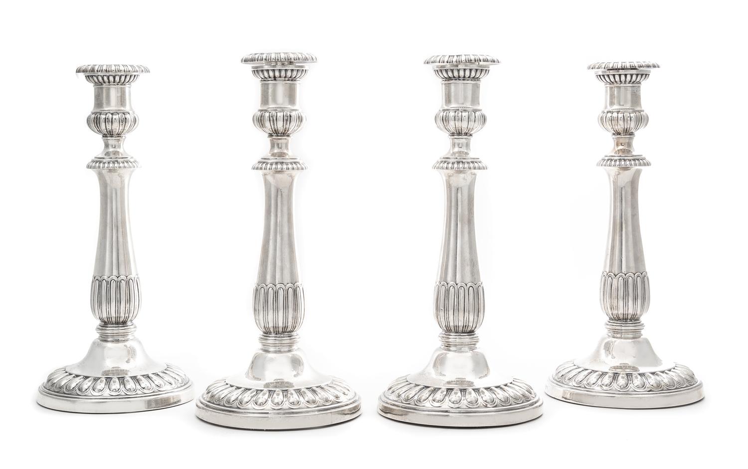 A Set of Four George III Silver Candlesticks, John Roberts & Co., Sheffield, 1808-9, each having an urn form candle cup with a gadroon