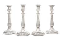 A Set of Four George III Silver Candlesticks, John Roberts & Co., Sheffield, 1808-9, each having an urn form candle cup with a gadroon