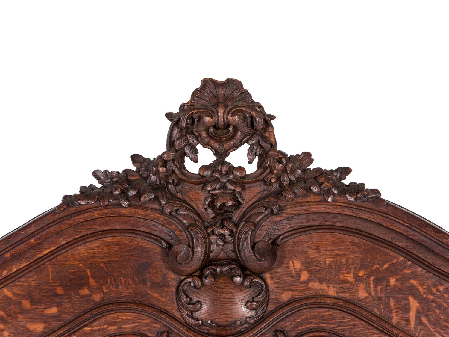 A Belgian Louis XV Style Carved Oak Trumeau Mirror
