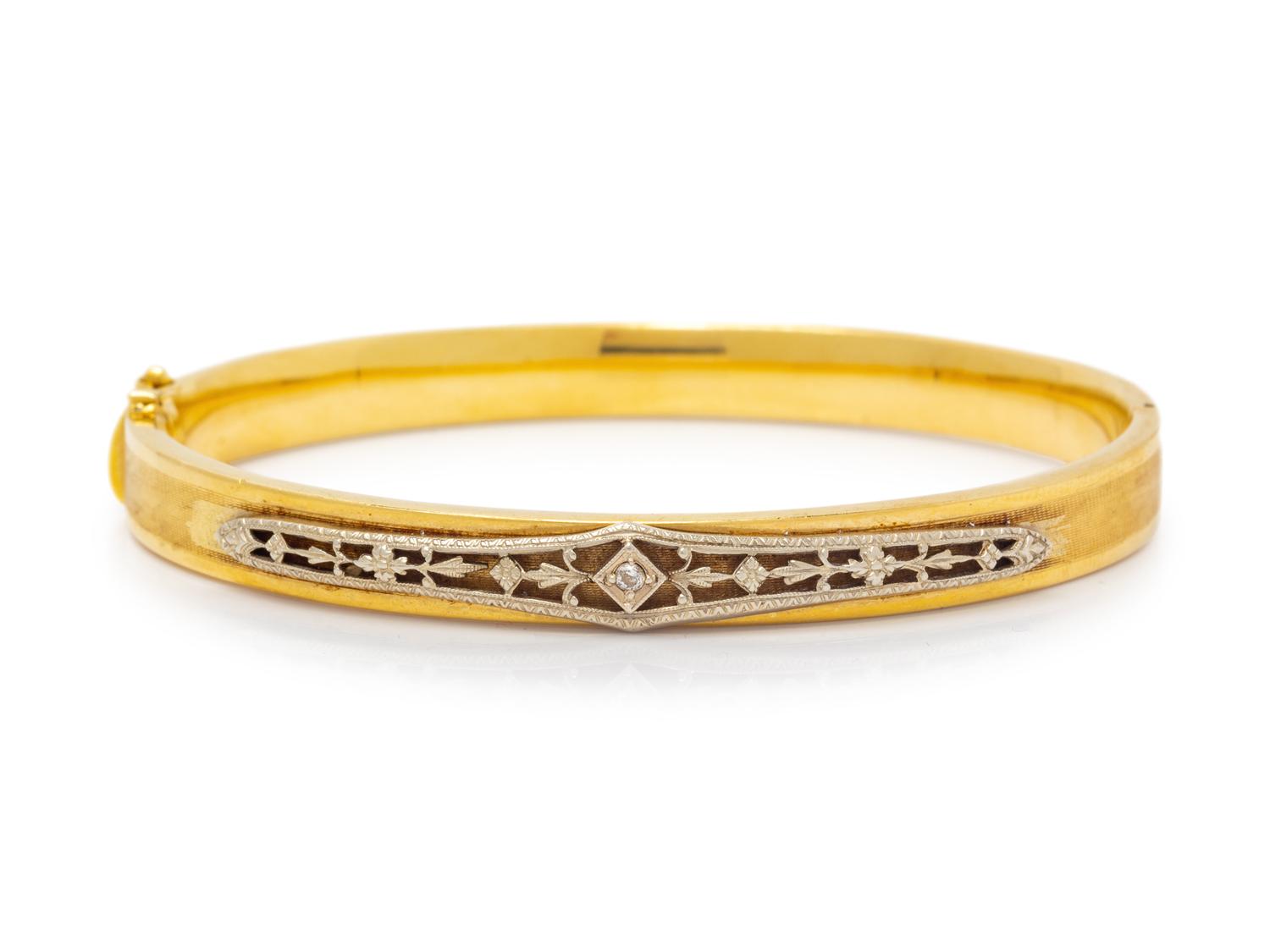 A Bicolor Gold and Diamond Bangle Bracelet,