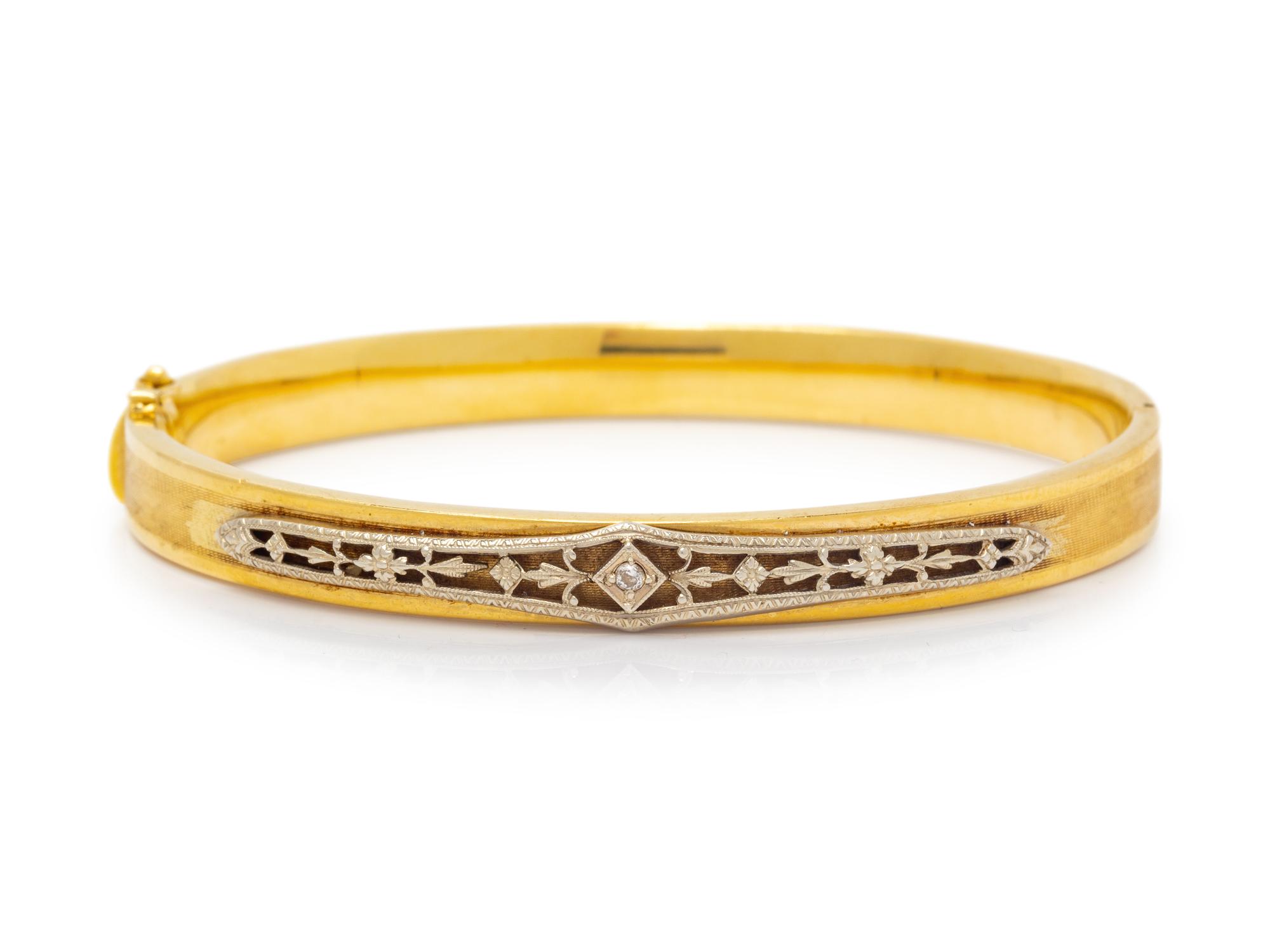 A Bicolor Gold and Diamond Bangle Bracelet,