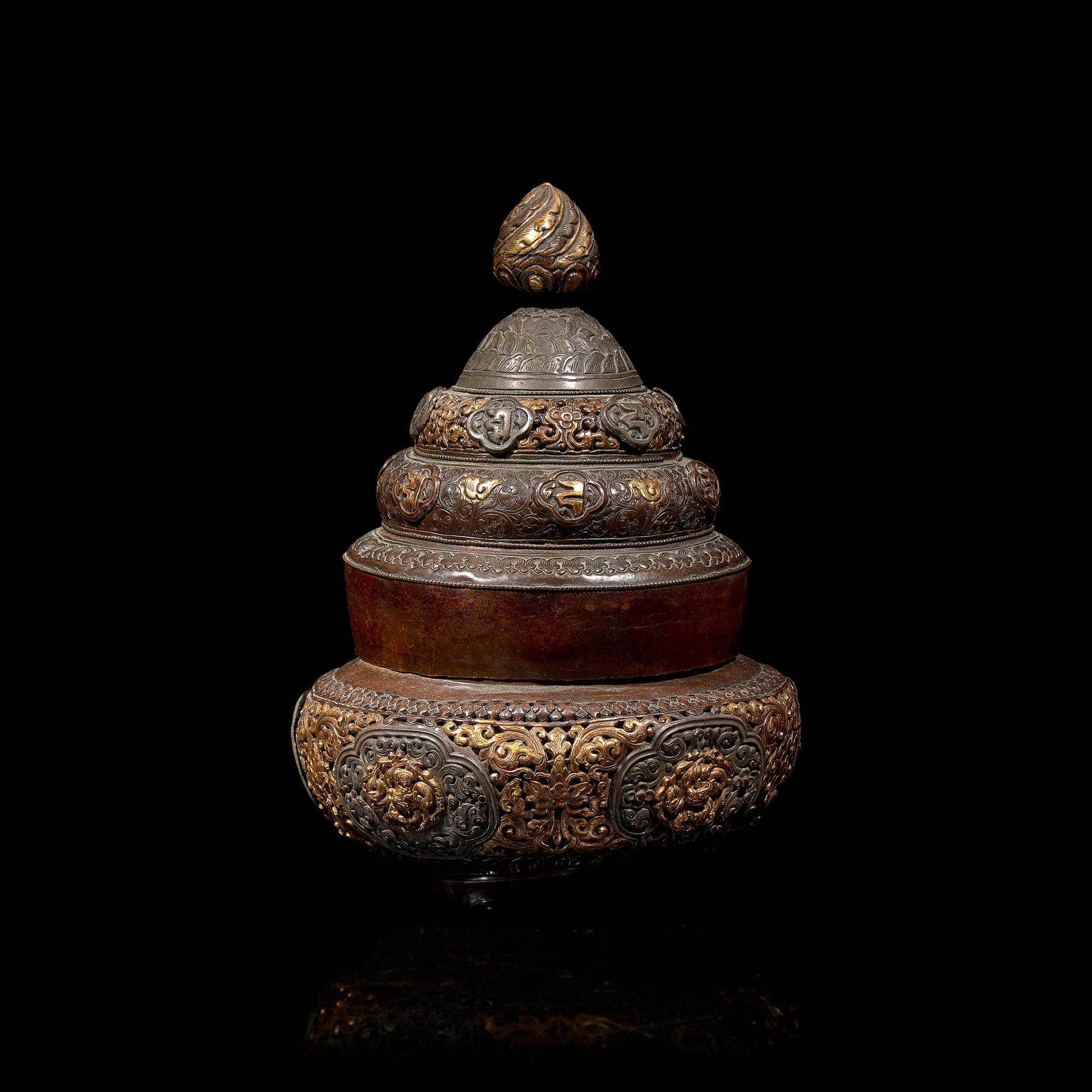 A Tibetan Silver Mounted and Parcel Gilt Copper Reticulated Censer and Cover 西藏嵌銀鎏金銅蓋爐