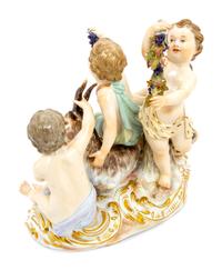 A Meissen Porcelain Group of Children Feeding a Goat