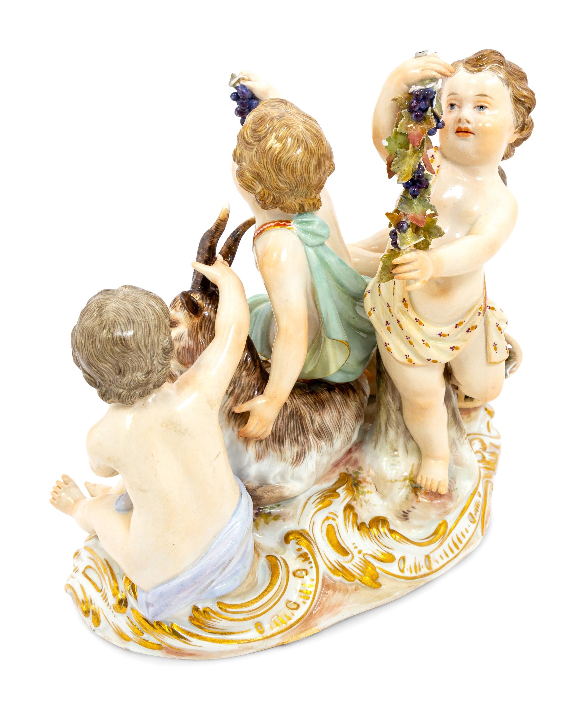 A Meissen Porcelain Group of Children Feeding a Goat
