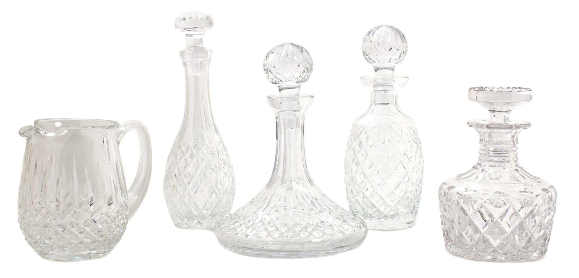 A Group of Four Cut Glass Decanters Height of tallest 11 1/2 inches.