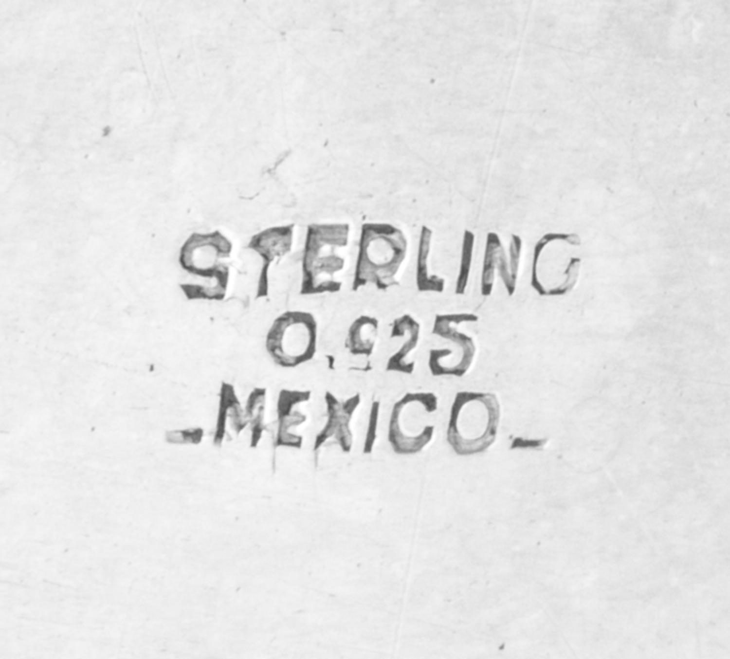 A Mexican Silver Dish, , having an undulating gadrooned rim, together with a silver-plate cloche with an engraved coat of arms.