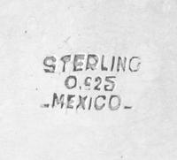 A Mexican Silver Dish, , having an undulating gadrooned rim, together with a silver-plate cloche with an engraved coat of arms.