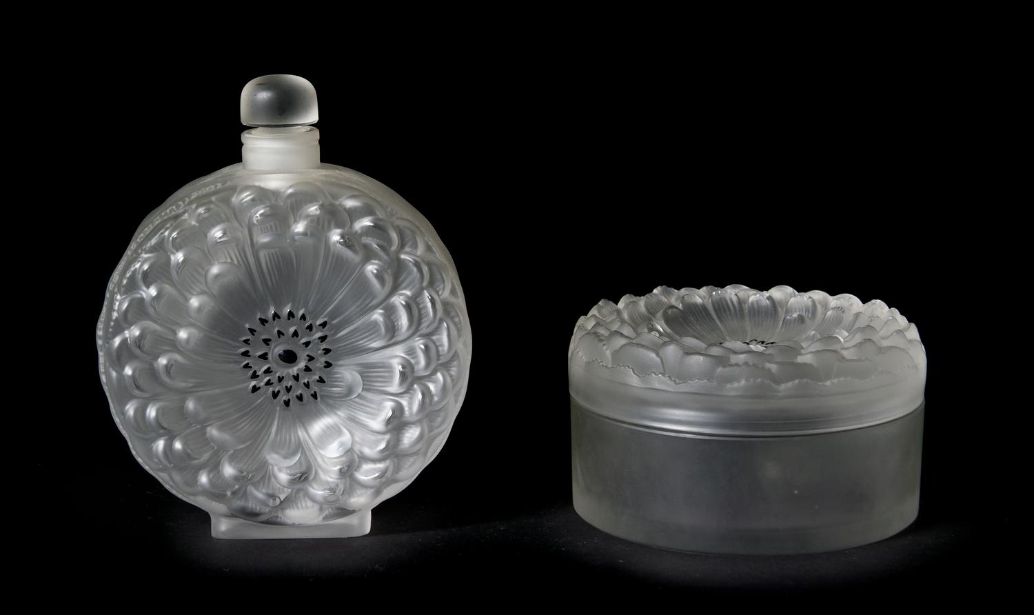 Two Lalique Molded and Frosted Glass Articles, Height of bottle 7 inches.