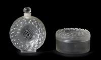 Two Lalique Molded and Frosted Glass Articles, Height of bottle 7 inches.