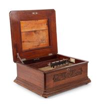 A Criterion 15 3/4 Inch Disc Music Box with 12 Discs