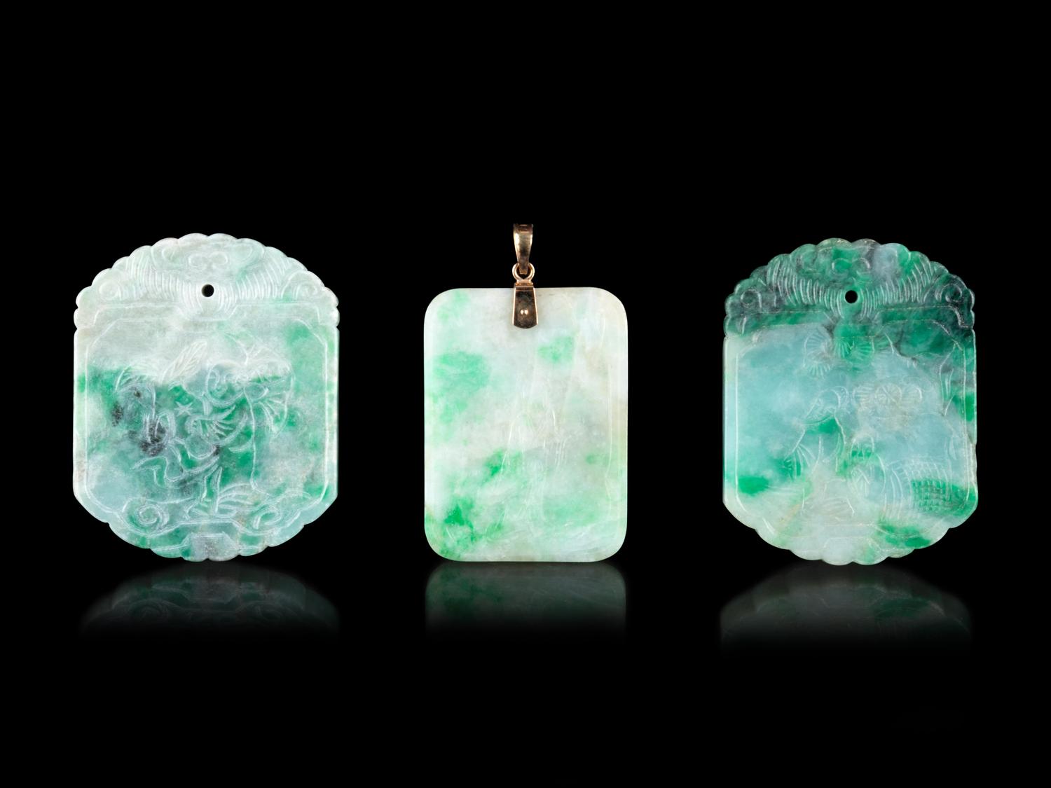Three Chinese Apple Green and White Jadeite Pendants