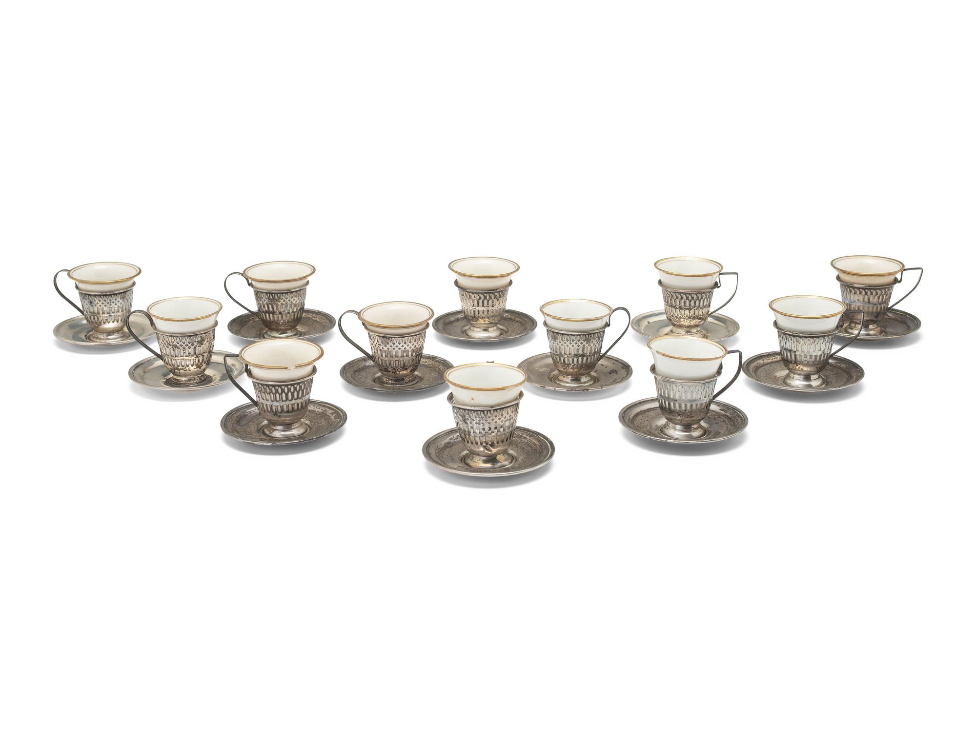 A Set of Twelve American Silver Coffee Cups and Saucers